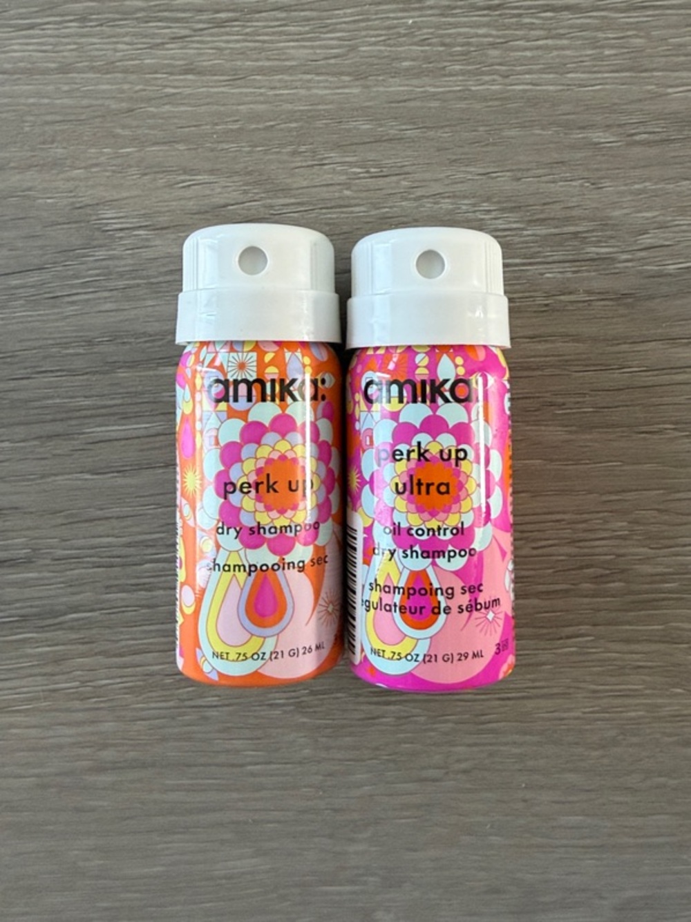 amika Perk Up Travel Dry Shampoo Duo in Pink & Orange Patterned Cans